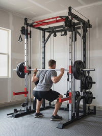 Short demo of a lifter squatting with the loaded barbell travelling up and down the Smith machine guide rails
